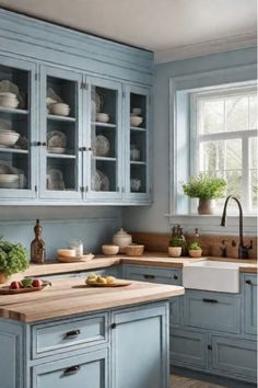 Farmhouse kitchen with distressed light blue cabinets Blue Cabinets With Butcher Block Counter, Blue Cabinets With Butcher Block, Blue Cupboards, Small Cottage Kitchen, Kitchen Table Centerpiece, Cozy Breakfast Nook, Cabinet Remodel, Brick Backsplash