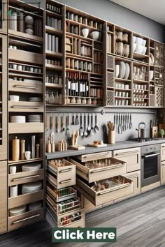 a kitchen with lots of wooden cabinets and drawers