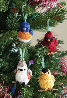 crocheted ornaments are hanging on the christmas tree