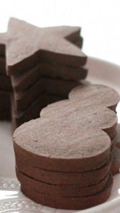 some cookies are sitting on a white plate