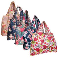 four floral bags are lined up against a white background and one is blue, the other has pink flowers on it