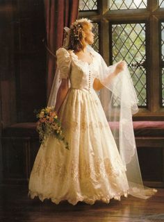 a woman wearing a wedding dress and veil