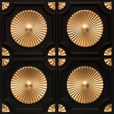 the ceiling is decorated in gold and black with four circular designs on each one side