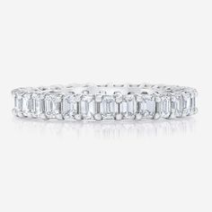 Custom made for you, please allow 5-8 weeks for production. A twist on the classic eternity band, pairs perfectly with our Emerald cut engagement rings! Platinum Diamonds: ~.08 cts each, G/H color, VS clarity 28 diamonds Total carat weight: 2.20 carats (based on finger size 6) Carat weight varies by finger size 3.10 mm width Made to order, allow 4-6 weeks Please contact to order custom sizes or gold Emerald Diamond Band, Emerald Eternity Band, Ring Concierge, Necklace Length Guide, Bracelet Size Chart, Emerald Cut Engagement, Diamond Eternity Band, Emerald Engagement Ring Cut, Radiant Diamond