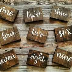 six wooden signs with the words one, two, three and seven written on them