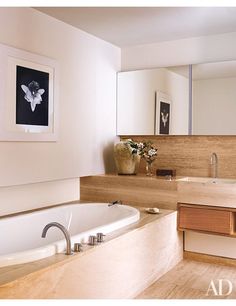 In the travertine-lined master bath, a Robert Mapplethorpe photograph is displayed above the tub, which is equipped with Vola fittings. Best Bathrooms, Marble Bathroom Designs, Entryway Tile, Bathroom Details, Gramercy Park, Bathroom Powder Room, Marble Sink, Bathtub Design, Luxury Bathrooms