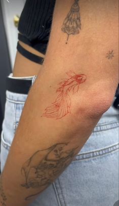 a person with a tattoo on their arm