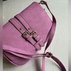 This Merona Crossbody Purse Handbag In A Beautiful Shade Of Purple Is Perfect For Any Occasion. With A Rectangular Shape And Snap Closure, It Features A Medium Size With A Bag Width Of 11 Inches, A Bag Height Of 7 Inches, And A Bag Depth Of 3 Inches. The Crossbody Strap Is Adjustable And Made Of Faux Leather, As Well As The Handle/Strap Color Is Also Purple. Inside Has An Open Pocket Along The Front Which Is Perfect For A Phone. Inside Has A Zipper Pocket And 2 Slip Pockets. Snap Closure On The Chic Purple Satchel With Adjustable Strap, Chic Purple Shoulder Bag With Adjustable Strap, Purple Crossbody Bag With Adjustable Handle, Purple Crossbody Bag With Adjustable Strap, Chic Purple Bag With Adjustable Strap, Chic Purple Crossbody Bag, Purple Satchel Bag With Adjustable Strap, Purple Satchel Shoulder Bag With Adjustable Strap, Purple Crossbody Satchel With Adjustable Strap