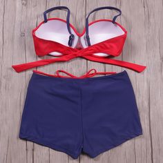 This two-piece swimsuit is perfect for your next day at the beach, pool or lake. Featuring a slightly padded top and boy shorts with a drawstring waist, this offers both style and comfort. Made with a spandex and polyester blend and comes in 5 fabulous color patterns from which to choose. Beach Season Swimwear With Built-in Shorts, Summer Swim Dress With Built-in Shorts For Poolside, Vacation Tankini With Built-in Shorts, Beachwear Swim Trunks With Built-in Shorts For Summer Activities, Blue Summer Shorts For Summer Activities, Summer Beachwear Swimwear With Built-in Shorts, Beachwear Swimwear With Built-in Shorts For Summer, Swimwear With Built-in Shorts For Beach Party Vacation, Beachy Swimwear With Built-in Shorts