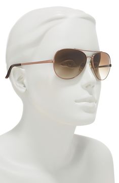 Some aviator shaped sunglasses add a chic accent for any look while protecting your eyes from the sun. 58mm lens width; 14mm bridge width; 135mm temple length Metal, plastic Imported Spring Aviator Sunglasses With Gradient Lenses, Trendy Brown Aviator Sunglasses, Classic Aviator Sunglasses For Spring, Spring Aviator Sunglasses With Uv Protection, Spring Aviator Sunglasses With Tinted Lenses, Classic Spring Aviator Sunglasses With Polarized Lenses, Brown Aviator Sunglasses For Travel, Summer Brown Aviator Sunglasses For Travel, Brown Aviator Sunglasses For Summer Travel