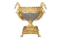 an ornate gold and blue vase sitting on top of a stand