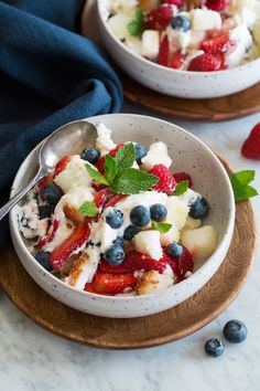 two bowls filled with fruit and ice cream