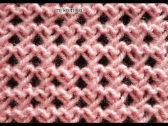 a close up view of a pink knitted material