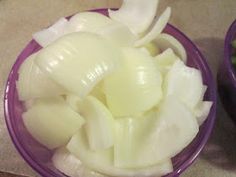 onions are cut up in small purple bowls