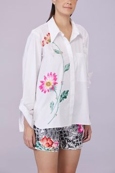 White full sleeves shirt with aster bloom embroidery. - Aza Fashions Spring Workwear Shirt With Embroidered Cuffs, White Long Sleeve Blouse With Floral Applique, White Floral Embroidered Shirt For Work, Spring Daywear Shirt With Floral Embroidery, Floral Embroidered Cotton Shirt For Work, Cotton Shirt With Floral Embroidery For Work, White Tops With Embroidered Cuffs For Workwear, White Aster, Bloom Embroidery