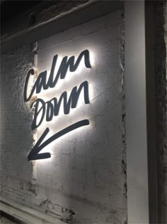 a sign that says calm down on it