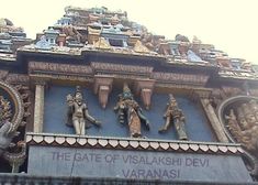 an ornately decorated building with statues on it