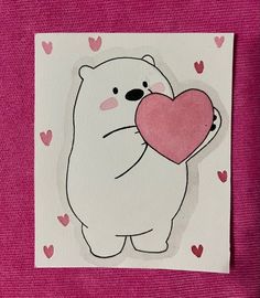 a polar bear holding a heart on a pink background