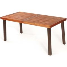 a wooden table sitting on top of a white floor