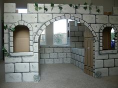 an image of a castle made out of bricks and paper machs with ivy growing on the walls