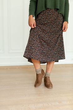 A fan favorite is back – meet the 'Annette' floral midi skirt! This midi skirt is adorned in a lovely ditsy floral print and has so many fun pairing opportunities. Style with a comfy sweater and low ankle boots for a charming fall ensemble! Exclusively designed by us with you in mind. 100% Polyester Fully Lined Hand Wash Cold Separately Hang or Lay Flat to Dry Iron Low Heat If Needed Do Not Bleach Do Not Dry Clean Model Height 5'8" | Wearing Size 1X Model Height 5'6" | Wearing Size Small Please Ditsy Floral Print Tiered Skirt, Bohemian Non-stretch Midi Skirt, Black Floral Print Midi Skirt, Long Floral Print Skirt, Relaxed Fit, Non-stretch Floral Print Midi Skirt, Low Ankle Boots, Floral Midi Skirt, Slip Skirt, Layered Tops