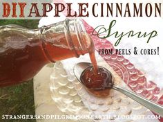 homemade diy apple cinnamon syrup from peels and corees is being poured into a glass jar