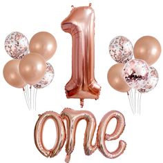 the number one balloon is surrounded by balloons and confetti in gold, silver or pink