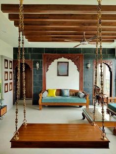 a living room filled with furniture and wooden beams