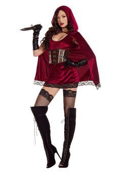 a woman dressed in a costume holding a knife