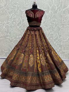 This exquisite ensemble features intricate dori work, multi-thread work, patchwork, zari work, sequin work, and diamond work, making it a true masterpiece. The maroon and golden color combination exudes elegance and luxury, perfect for your special day.
This bridal lehenga set is truly unique and eye-catching. From the exquisite dori work to the shimmering sequin work, every detail has been carefully crafted to ensure you stand out on your wedding day. The semi-stitched lehenga can fit up to 42 Golden Color Combination, Velvet Bridal Lehenga, Double Dupatta, Engagement Gown, Dori Work, Lehenga Crop Top, Lehenga Choli Wedding, Floral Lehenga, Stitched Lehenga