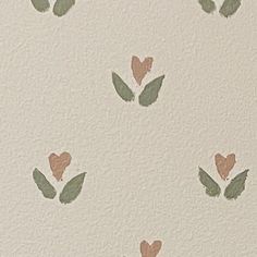 some green leaves and brown hearts on a white wallpapered room with light colored paint