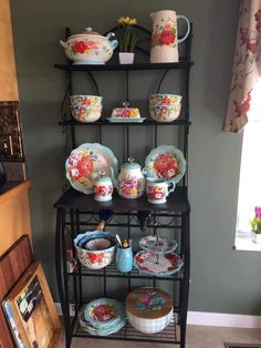 a shelf with plates and bowls on it