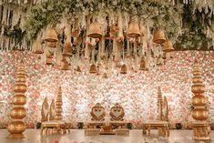 an elaborately decorated room with floral wallpaper and chandeliers hanging from the ceiling