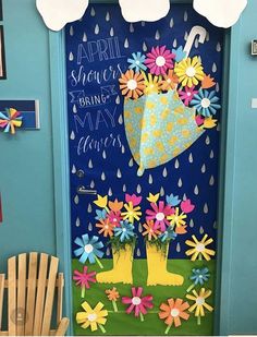 a door decorated with flowers and umbrellas for the springtime break - up party