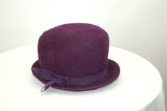 "This 1960s purple felt fur hat is really fun and mod! Love the rich grape purple color and the tall dome crown - like a bowler hat only exaggerated! It's fuzzy and warm, and would be a great addition to your vintage hat collection. Made by Kurtz, with union label. It measures 21.5\" in circumference and stands 5\" tall in front and 4\" in back, with a 2\" brim in front and 1.5\" brim in back. Very good condition. * Proud member of the Vintage Fashion Guild * For more vintage fashions, visit Vin Purple Hat, Hickory Nc, Purple Hats, Bowler Hat, Hat Collection, Vintage Hat, Fur Hat, Union Made, Hats Vintage