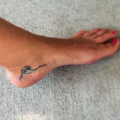 a person with a small tattoo on their foot