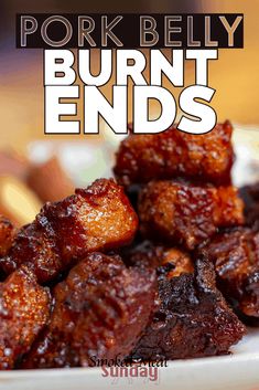 pork belly burnt ends on a plate with text overlay that reads pork belly burnt ends