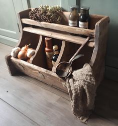 an old wooden spice rack with spices and herbs