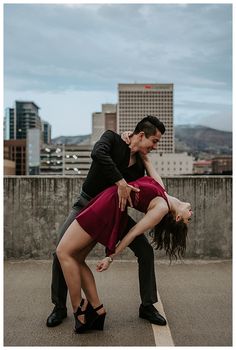 a man and woman are dancing in the street