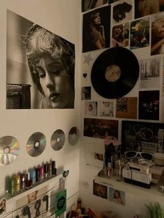 there are many records on the wall in this room