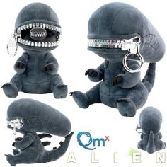 an alien stuffed animal with silver teeth and mouth rings