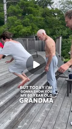 an older man and woman doing yoga on a deck