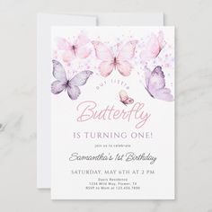 the butterfly birthday party is set on top of a marble table with pink and purple butterflies