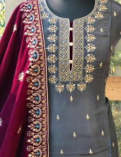 Item Overview ATHARVA Hand Embroidery Salwar Kameez/Chanderi Shirt/Embroidery Neck/Grey/Tilla Embroidery Wine shade Velvet Dupatta/Custom Stitch Unstitch Dno. VL09C Fabric: * Shirt - Chanderi Silk- Hand Embroidered Neck- 2.5 Mts /Bootis all over * Dupatta: Embroidered Velvet Dupatta- 4 Side Border Embroidery - 2.5 Mts- Latkans Tassels - * Bottom Santoon Silk 2.5 Mts. Excusive Hand Embroidered Party Wear Punjabi Suit. Customization: * Fabrics Customization: Designs Can be made in different Fabric Designer Gray Set With Zari Work, Festive Gray Zari Work Sets, Gray Resham Embroidery Kurta For Wedding, Gray Anarkali Set With Zari Work, Gray Anarkali Set With Dupatta, Gray Festive Sets With Resham Embroidery, Gray Anarkali Set For Festive Occasions, Festive Embroidered Gray Sets, Festive Gray Sets With Dupatta