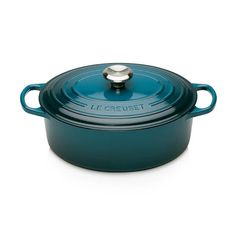 a blue casserole dish with a lid and handle on the side, against a white background