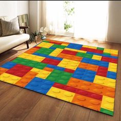 a living room with a large rug made out of lego blocks