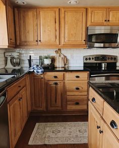 the kitchen is clean and ready for us to use it's new stainless steel appliances