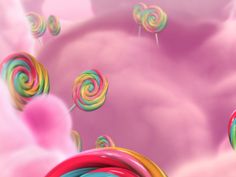 colorful lollipops floating in the air with pink clouds