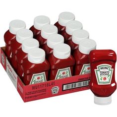 twelve bottles of heinz's tomato ketchup next to a box of 12