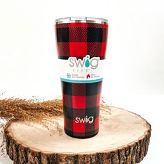 This is a red buffalo plaid cup in red and black, with a silver metallic top. This cup is taken on top of a slab of wood with a brown plant in the side  as decor. Cabin Chic, Red Buffalo Plaid, Giddy Up Glamour, Trendy Tree, Tree Farm, Tree Farms, Copper Plated, Plaid Design, Favorite Drinks